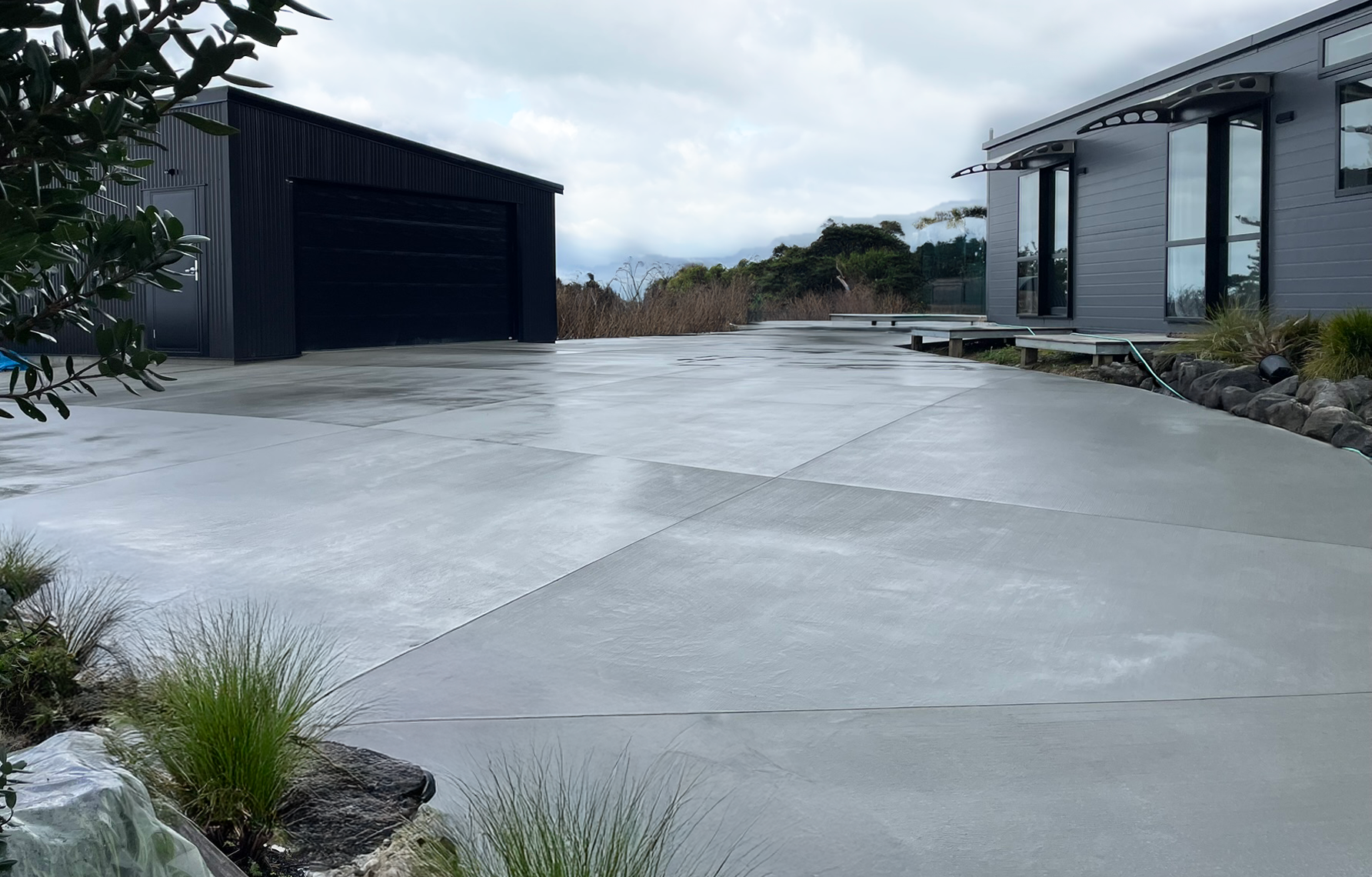 Wide view of a residential concrete driveway project example